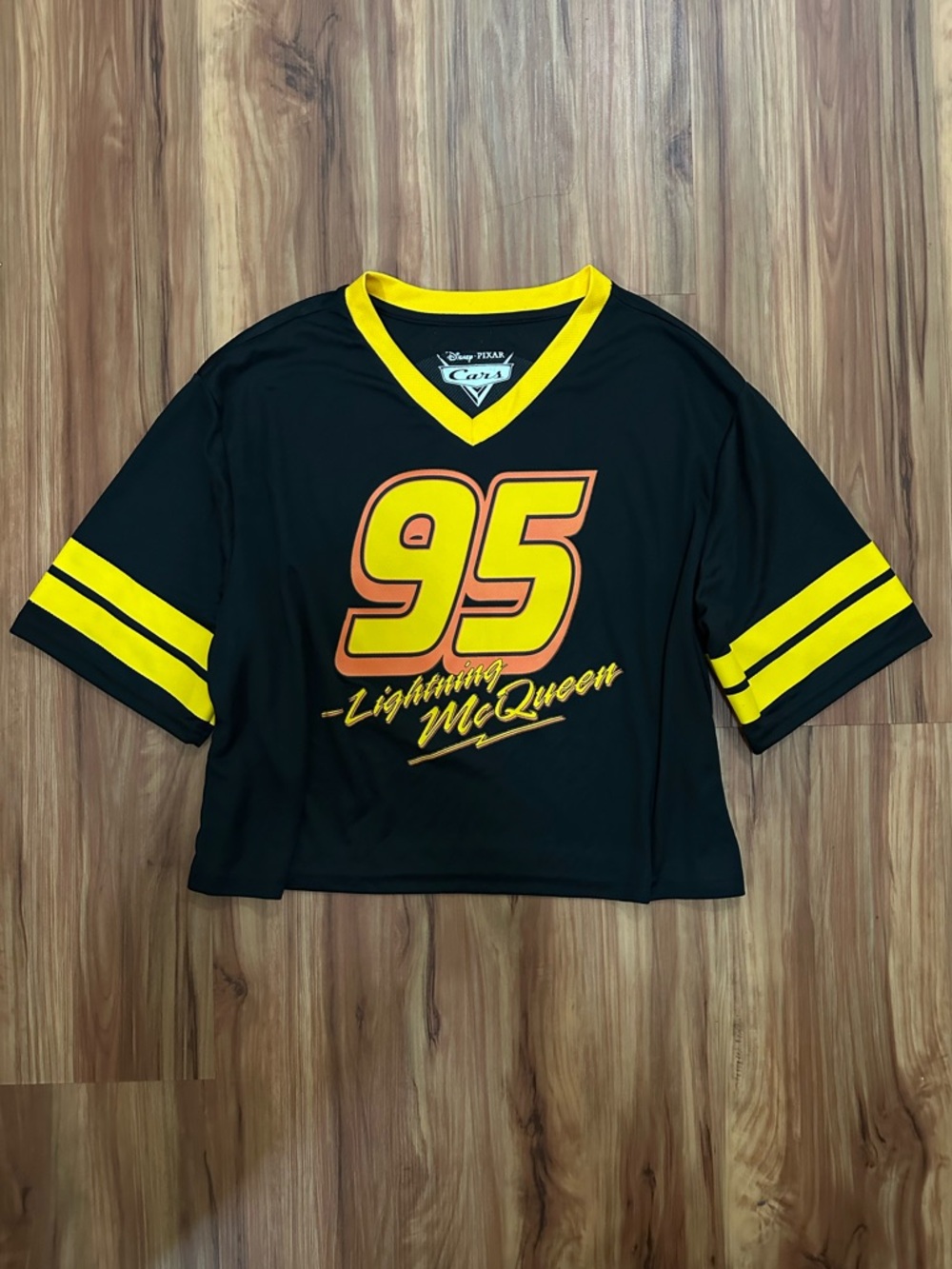NWOT Disney Pixar Cars Lightning McQueen 95 Black & Yellow Cropped Jersey Top